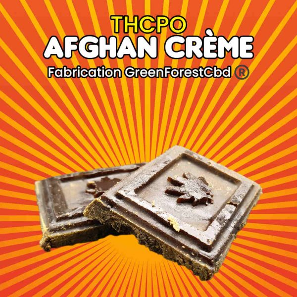 Morceau de Hash Afghan Crème THCPO de Green Forest Cbd®, présentant la texture intérieure et le détail de la feuille de cannabis.